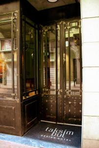 an entrance to a building with glass doors at Taksimbul Design Hotel in Istanbul