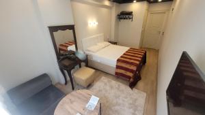 Postel nebo postele na pokoji v ubytování MEHMET BEY HOTEL