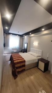 Postel nebo postele na pokoji v ubytování MEHMET BEY HOTEL