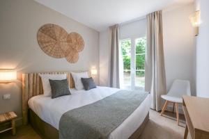 Posteľ alebo postele v izbe v ubytovaní Villa Rêve de Plage proche St-Tropez