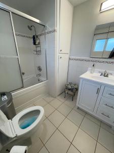 a bathroom with a toilet and a sink at Private Room in Los Angeles LA with TV & WIFI & AC & View of Hollywood Sign & Private Fridge & Shared Kitchen!!! in Los Angeles