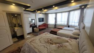 Postel nebo postele na pokoji v ubytování MEHMET BEY HOTEL