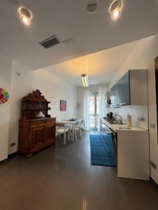a kitchen and living room with a counter and a table at Casa Costanza in Maiori