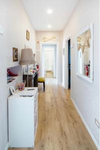 a kitchen with a white refrigerator in a room at Casa Lina in Civitavecchia +16 photos