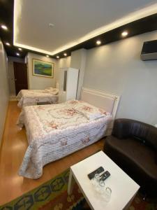 Postel nebo postele na pokoji v ubytování MEHMET BEY HOTEL