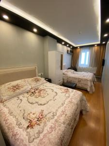Postel nebo postele na pokoji v ubytování MEHMET BEY HOTEL