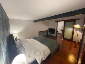 a bedroom with a bed and a television in it at Residence Bruno in Foggia