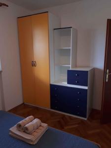 a bedroom with a bed with a dresser and a mirror at Apartment Valbandon, Istria 6 in Valbandon