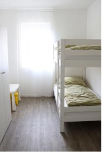 a room with two bunk beds and a window at FeWo Rodalben Pfalz in Rodalben