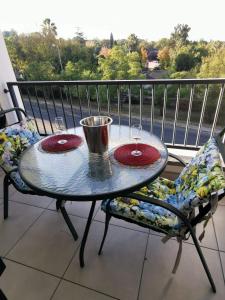 a table and two chairs on a balcony with a view at Teasa Stays - Upliving Lifestyle nearby Fourways in Northriding