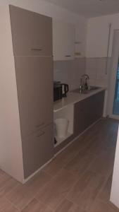 a kitchen with a sink and a counter top at Apartement auf dem Lande in Rudelzhausen