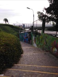 a set of steps with graffiti on a wall at Mar Private Rooms in Lima