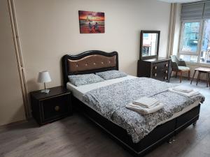 Postel nebo postele na pokoji v ubytování ÖZYÜREK HOUSE