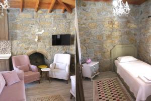 1 dormitorio con cama y pared de piedra en KALYOPİ TAŞ BUTİK OTEL, en Gokceada Town