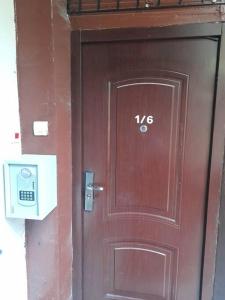 una porta marrone con il numero sopra di ALWAYS A HUGE SALE! a Budapest