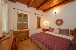 Кровать или кровати в номере Watermill Villa & Hotel Faralya
