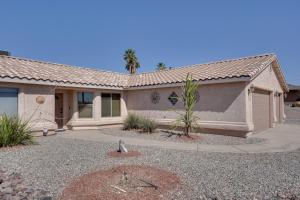 a house with a garage in front of it at Arizona Retreat with Casita about 2 Mi to Lake Havasu in Lake Havasu City