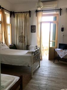 a bedroom with a bed and a sliding glass door at Villa Elli 