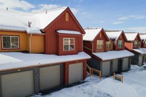a row of houses with snow on the roofs at Waterside West A303 in Fraser