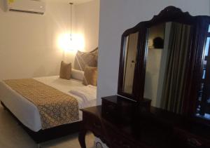 Postel nebo postele na pokoji v ubytování Hotel Dorado Plaza Boutique Calle del Arsenal