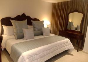 Postel nebo postele na pokoji v ubytování Hotel Dorado Plaza Boutique Calle del Arsenal