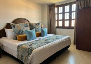 Postel nebo postele na pokoji v ubytování Hotel Dorado Plaza Boutique Calle del Arsenal