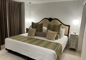Postel nebo postele na pokoji v ubytování Hotel Dorado Plaza Boutique Calle del Arsenal
