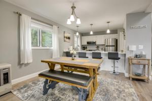 a kitchen and dining room with a table and chairs at Newfound Lake Vacation Rental with Deck and Lake View in Bristol
