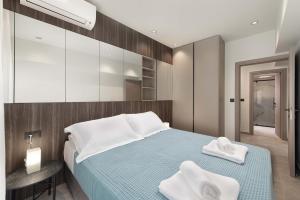 Ένα ή περισσότερα κρεβάτια σε δωμάτιο στο 30 Senses Luxury Apartment Insight