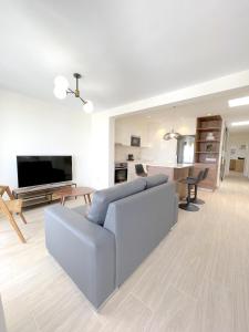 TV a/nebo společenská místnost v ubytování Casahost Bastian Beach