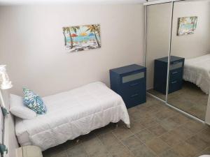 Cama ou camas em um quarto em 1st Level Unit Steps to Beach- Cold Air Conditioner at Poza del Mar Luquillo