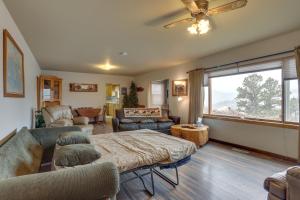 a living room with a couch and a table at Classic Mountain Home, Half Mi to Main Street in Lead