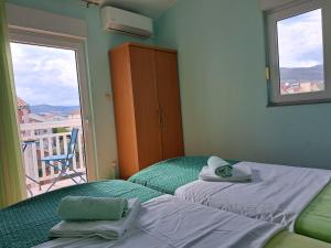 Posteľ alebo postele v izbe v ubytovaní Apartment Penić