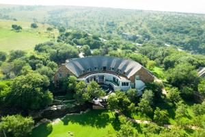 an aerial view of a building in the middle of a field at Mount Grace Hotel & Spa in Magaliesburg