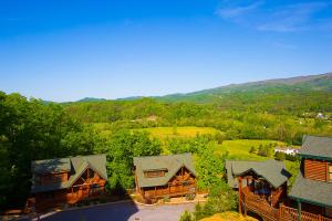 an aerial view of a home with mountains in the background at Misty Mountain Hideaway, 3 Bedrooms, Sleeps 10, Pool Access, WiFi in Pigeon Forge