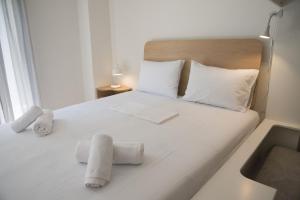 Postel nebo postele na pokoji v ubytování Syntagma View Apartment