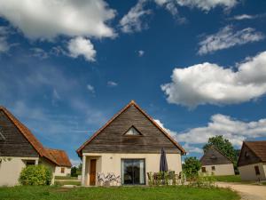 a house with a pitched roof with a blue sky at Lac Bleu 16 in Lacapelle-Marival