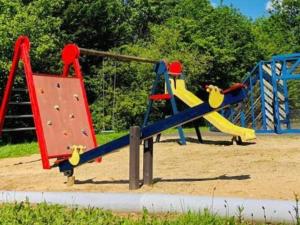 a playground with a slide and a climbing frame at Lac Bleu 16 in Lacapelle-Marival