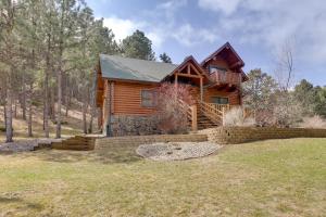 a log cabin in the woods with a yard at Piedmont Cabin about 10 Mi to Rapid City! in Piedmont