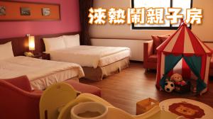 Krevet ili kreveti u jedinici u okviru objekta Hotel Leisure Tamsui