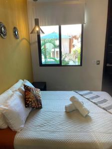 Postel nebo postele na pokoji v ubytování Hotel Diosa del Agua Bacalar