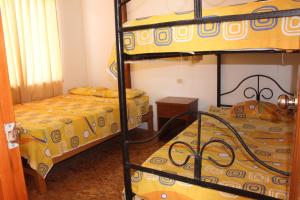 Dviaukštė lova arba lovos apgyvendinimo įstaigoje Casa de Playa Alarcon - Huacura