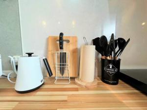 a counter with various kitchen utensils on it at とぅも～る in Ishigaki Island