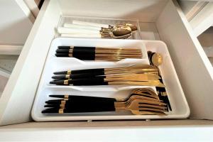 a white drawer filled with lots of makeup brushes at とぅも～る in Ishigaki Island