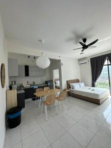 een woonkamer met een bank en een tafel bij The Sun 1 or 3BR Bayan Lepas 4 to 10 pax in Bayan Lepas