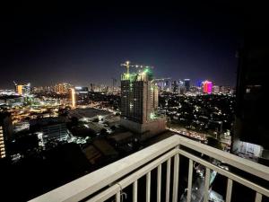 a view of a city skyline at night at Kasara relaxing abode in Manila