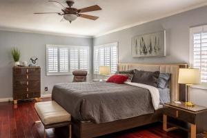 a bedroom with a bed and a ceiling fan at Stunning, Quiet Pvt Luxe Home! King Bed, Jacuzzi, Fire Pit, BBQ! Beautiful! in Los Angeles
