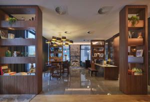 a restaurant with a table and chairs in a room at Adina Apartment Hotel Wiesbaden in Wiesbaden