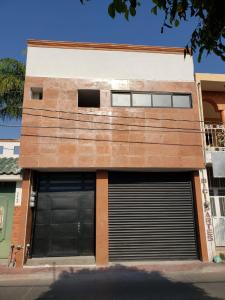 two garage doors on the side of a building at Hostal Purísima in San Francisco del Rincón
