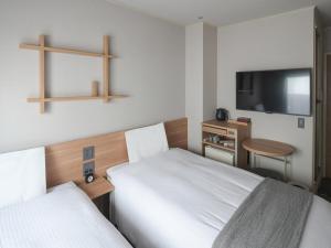 东京浅草筑波快速船舶酒店(Vessel Inn Asakusa Tsukuba Express)房間的床